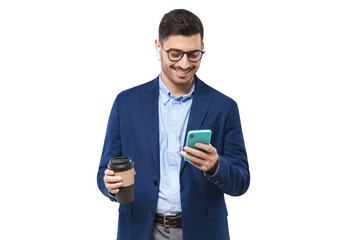 Businessman holding smartphone in one hand and takeaway coffee cup in another, looking at screen of...