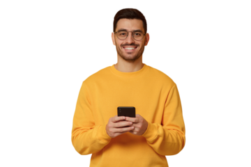 Young man wearing yellow sweatshirt, standing in front of camera with phone in hands