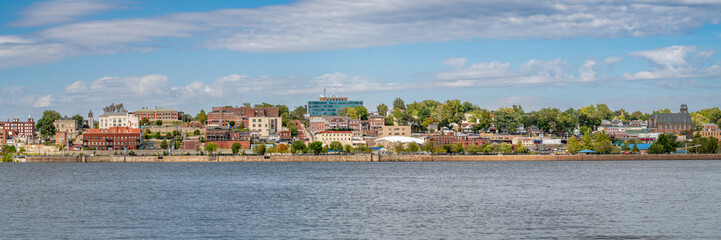 cityscape panorama of Alton in Illinois on a shore of the Mississippi River, a view from the Missouri shore - obrazy, fototapety, plakaty