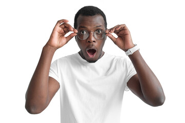 Young black man wearing round glasses, looking really surprised and shocked with mouth wide open and round eyes - Powered by Adobe