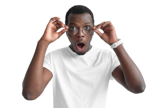 Young black man wearing round glasses, looking really surprised and shocked with mouth wide open and round eyes - Powered by Adobe