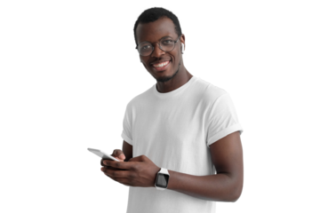 Young african american man looking and smiling at the camera, using mobile phone, listening to music with white wireless earphones