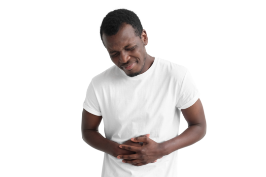 Upset unhappy young african american man holding his belly with both hands, suffering from abdominal pain