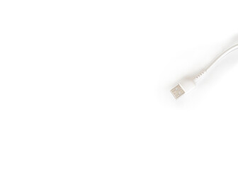 White charging adapter and cable on a white background