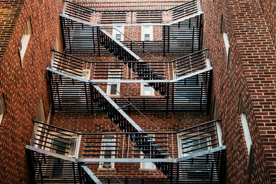 A view of fire stairs in one of the red brick buildings in New York City, United States.