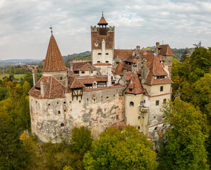 Aerial drone view of Bran Castle, Romania. Place of Dracula in Transylvania, Carpathian Mountains, romanian famous destination in Eastern Europe. 