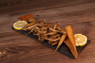 DEEP FRIED SEEFOOD, RECIPE FOR FISH, Smelt AND FRIED PITA, LEMON. High quality photo