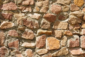 Background of an old wall made of red stone.