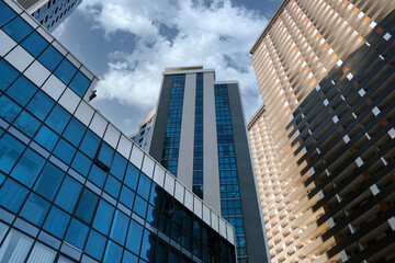 Close-up modern glass office buildings against the sky.