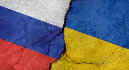 Russia and Ukraine flags, concrete wall texture with cracks, grunge background, military conflict concept
