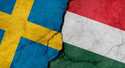 Sweden and Hungary flags, concrete wall texture with cracks, grunge background, military conflict concept
