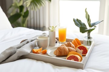 Fototapeta na wymiar Breakfast Tray Arranged On White Bed