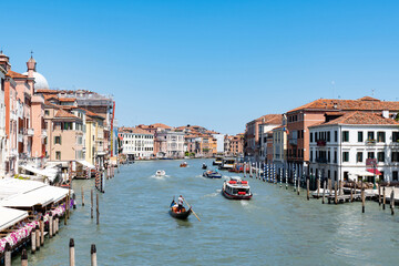 Scenic canal with ancient buildings in Venice, Italy on a sunny summer day