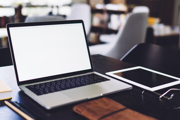 Stylish workplace with modern devices at table