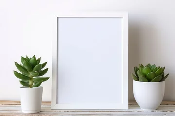 Foto op Plexiglas White frames on a shelf with a plant. Scandi style. © Inna