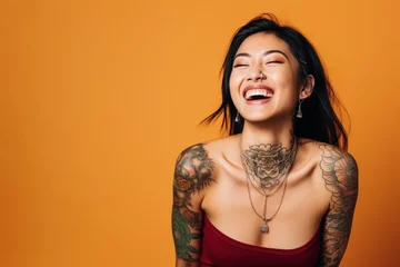 Foto op Aluminium Young woman with neck and face tattoos happy smiling laughing © blvdone