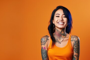 Young woman with neck and face tattoos happy smiling laughing