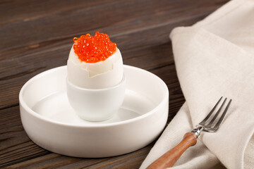 Boiled egg with red caviar
