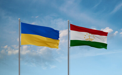 Tajikistan and Ukraine flags, country relationship concept