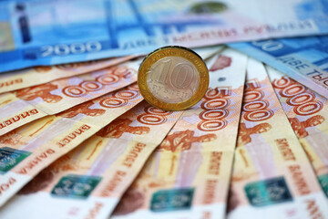 Russian rubles, coin and paper currency. Concept of economy of Russia, exchange rate