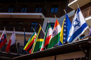 Flags of countries hanging on a flagpole, international conference, business forum meeting