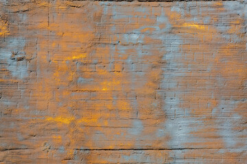 The background of the wall, stucco rough surface. Gold and blue. Background or texture for design