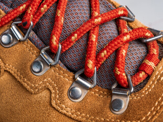 Laces on modern leather hiking boots, macro shot selective focus