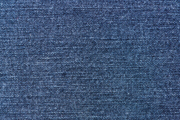 Blue jeans fabric background texture. Denim. Close up view.