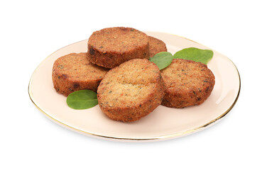 Plate of delicious vegan cutlets and spinach isolated on white