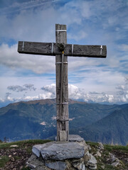 Wood cross on a mountain veto on Lake Como