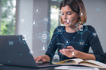 Pensive attractive beautiful businesswoman in formal wear working on laptop, talking phone in the office. Concept of network connection information technology.