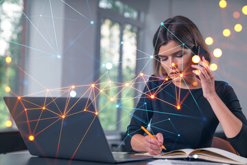 Pensive attractive beautiful businesswoman in formal wear working on laptop, talking phone in the office. Concept of network connection information technology.