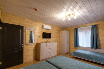interior of wooden eco bedroom in studio apartments,  hostel or homestead