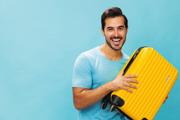 Man studio suitcase vacation weekend trip flight traveler yellow travel baggage journey background...