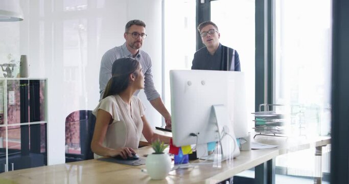 Business people, computer and advice with team in office for online information, planning update and research. Group, diversity and employees at desktop for website review, collaboration and project