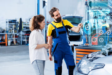 Technician in repair shop using augmented reality holograms to show client car performance parameters during maintenance. Trained garage employee using futuristic vr headset to examine damaged engine