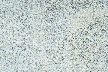 Broken reinforced, hardened or laminated glass to little pieces like mosaic. Cracked glass on white background. High resolution abstract texture