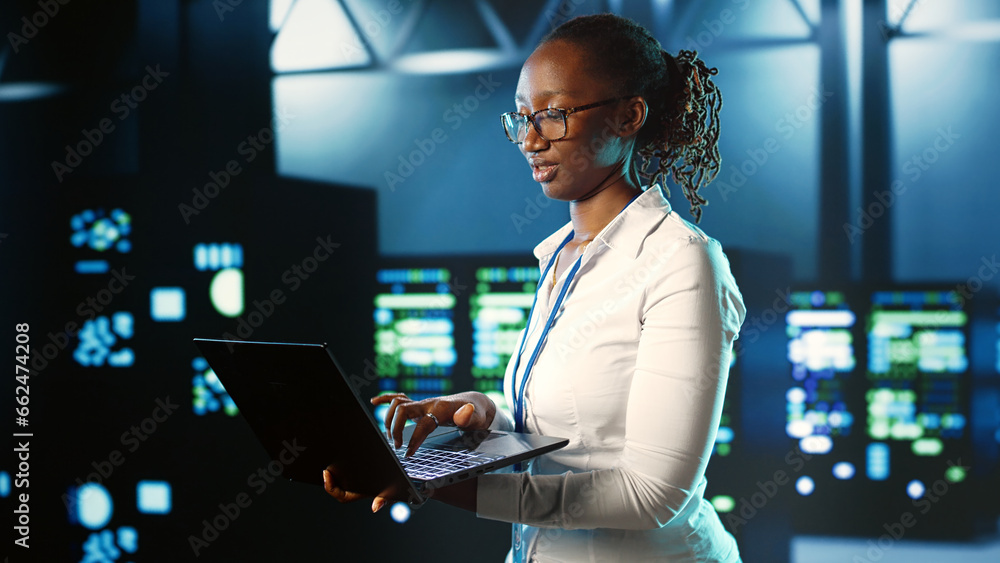 Poster focused it consultant strolling through server rows providing processing resources for different wor