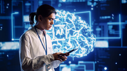 Focused technician in data center using artificial intelligence computing simulating human brain thought processes. Server room employee works on tablet with AI machine learning algorithms