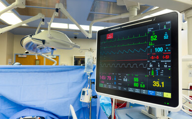 hospital monitor displaying vital signs: heart rate, blood pressure, temperature, and pulse oximetry, highlighting advanced medical technology in patient care