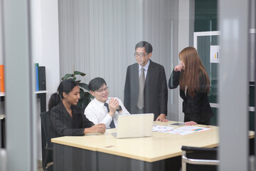 Business People, Successful business professionals. Diverse team celebrating business success at meeting.