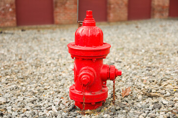 fire hydrant stands on a city sidewalk, symbolizing safety, preparedness, and emergency response, framed by urban surroundings