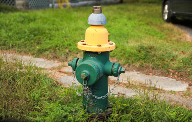 fire hydrant stands on a city sidewalk, symbolizing safety, preparedness, and emergency response,...