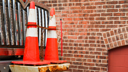construction cone on urban road, representing safety, work in progress, and traffic control in a...