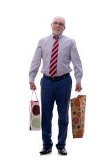 Old businessman holding bags isolated on white