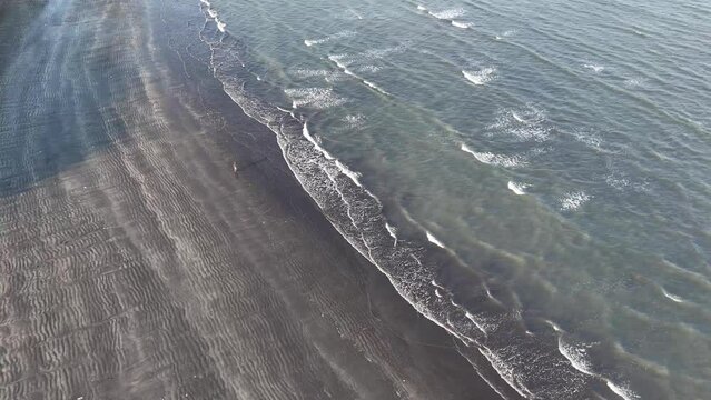 aerial view of black sand beach in banyuwangi east java indonesia.