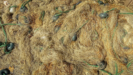 Close up view of Orange Fishing nets on the pier. Urla, Izmir