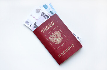 passport of a Russian citizen and invested rubles on a white background. pension, salary, loan or payment from a purchase or sale. fight against corruption and bribes