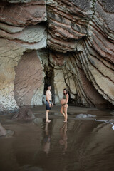 pregnant couple on the beach