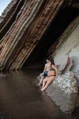 pregnant couple on the beach